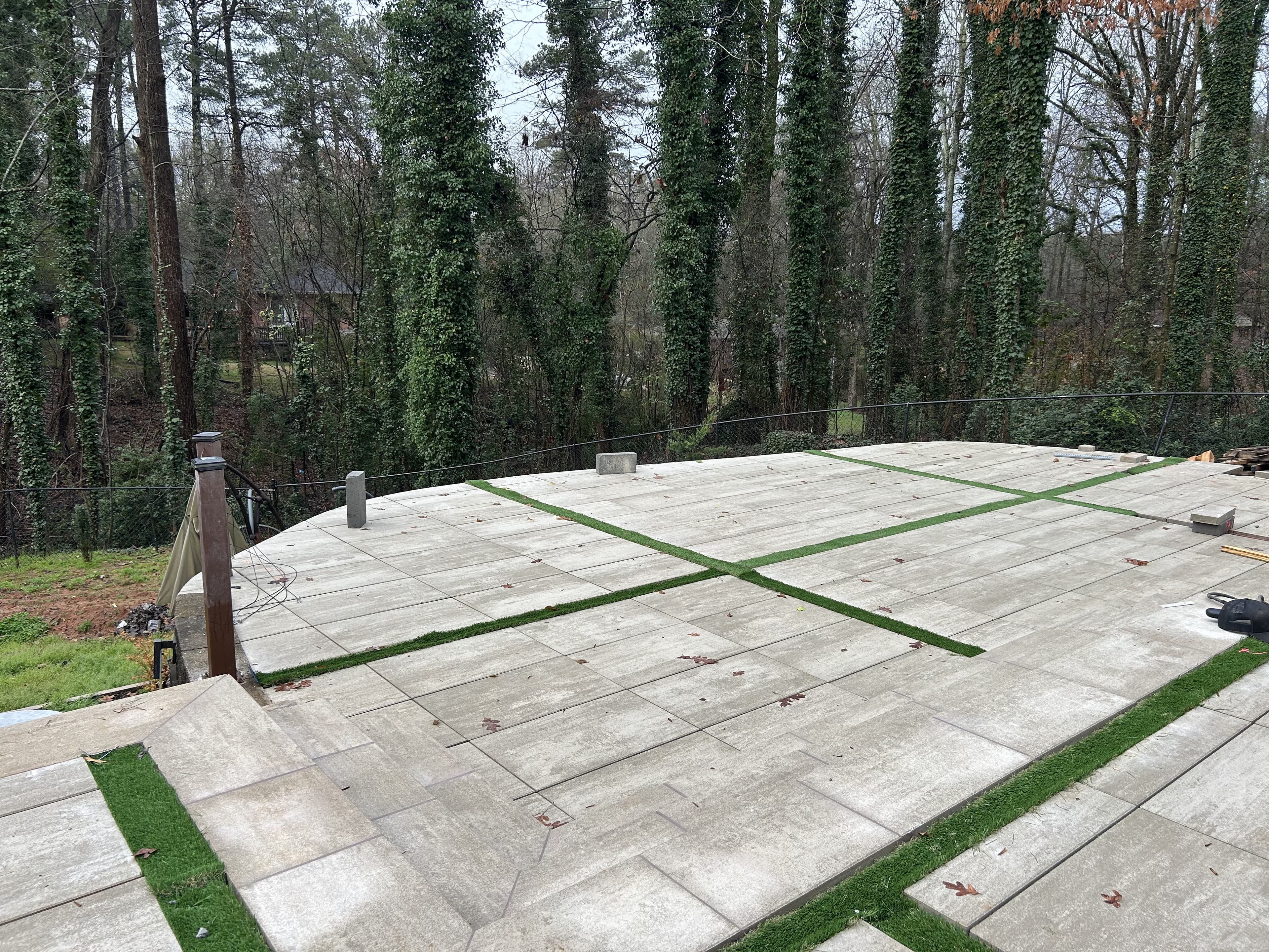 Artificial turf and paver integration around a pool in Buckhead, Atlanta